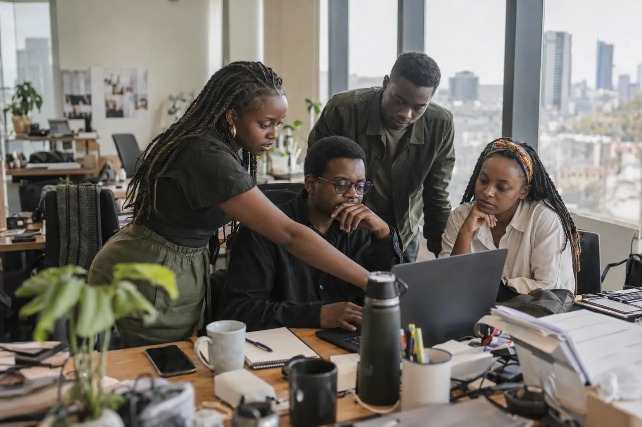 A marketing team reviewing campaign charts in a Nairobi office