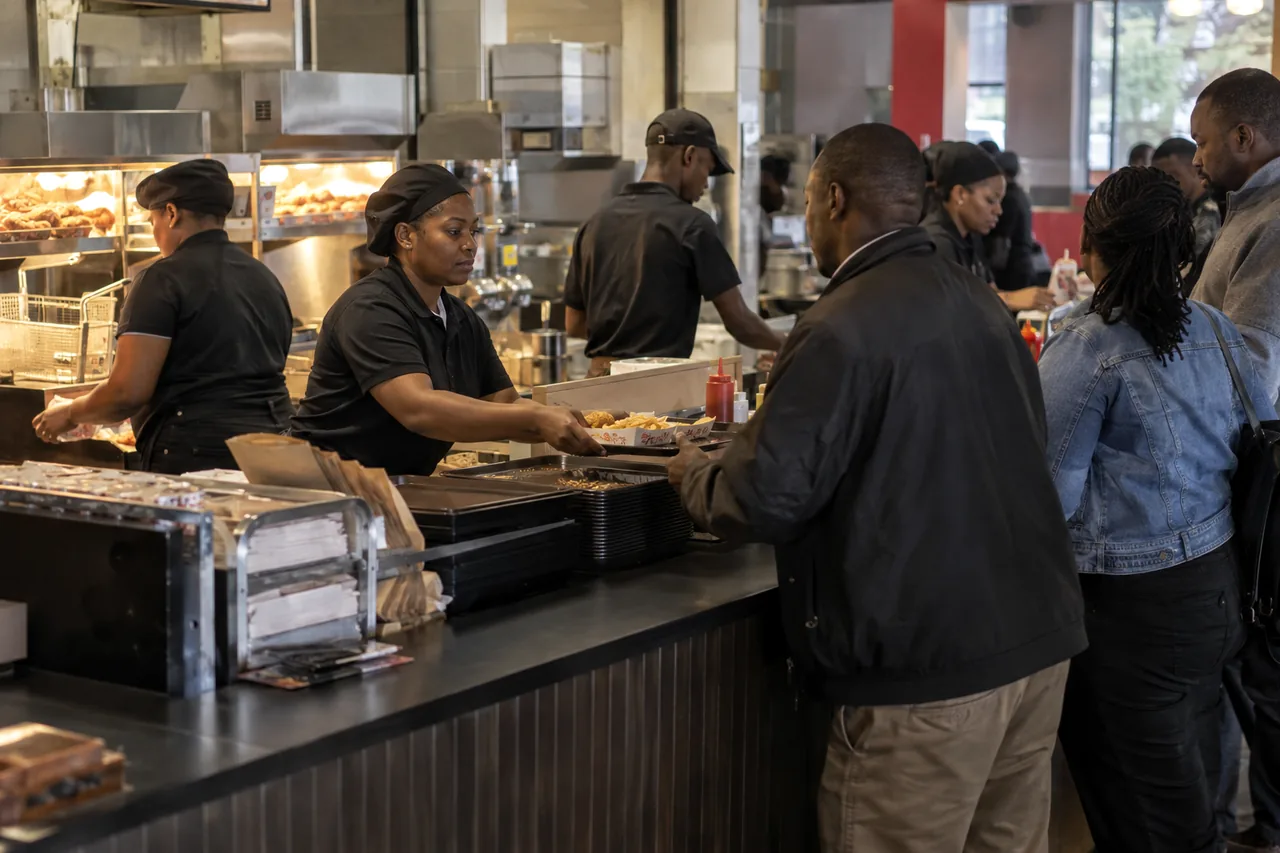 Staff serving customers at a fast food counter in Nairobi